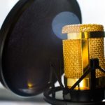 close-up-photo-of-gold-colored-and-black-condenser-682082
