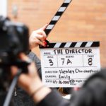 man-holding-clapper-board-1117132