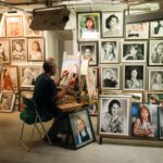 man-sitting-on-chair-painting-inside-room-989917